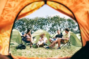 view from inside of a festival tent onto campers