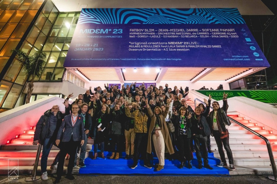 Posing for a picture in front of the entrance of Midem+ 2023