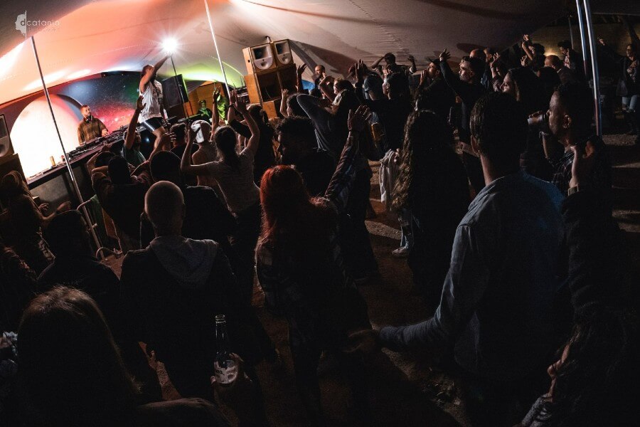 A crowd of people in front of the Moon stage