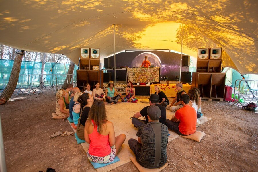 People sitting in front of speakers at Boomerang Festival in Malta