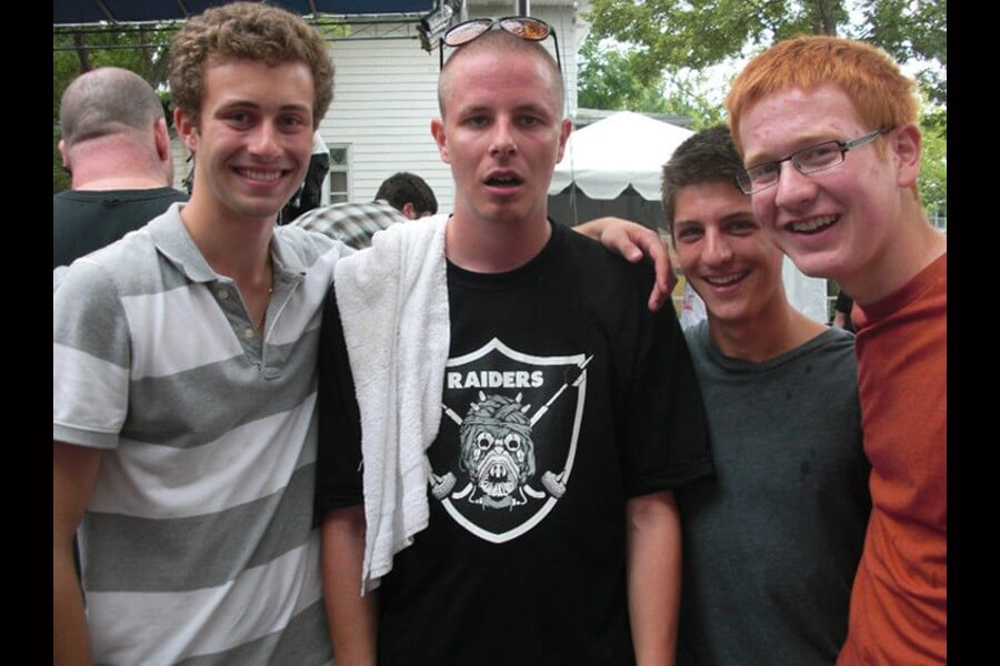 Prof rapper posing with my brother and his friends after a 2009 Minneapolis block party