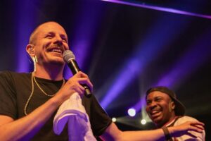 (Left to right) Prof and Wonka on stage.