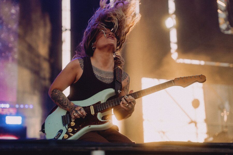 Tash Sultana playing guitar