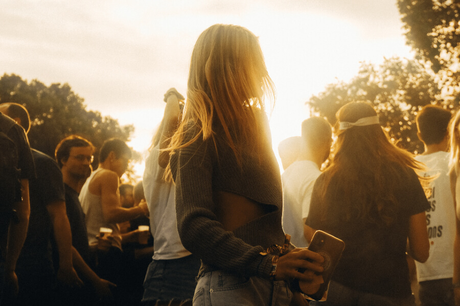 Festival attendee dancing in the afternoon light