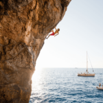 Chris Sharma deep water soloing along the coastline of Mallorca.