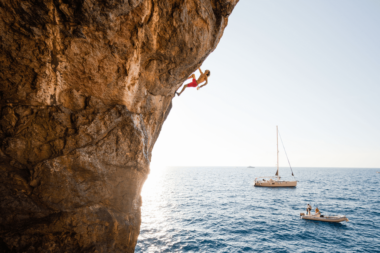 Chris Sharma deep water soloing along the coastline of Mallorca.