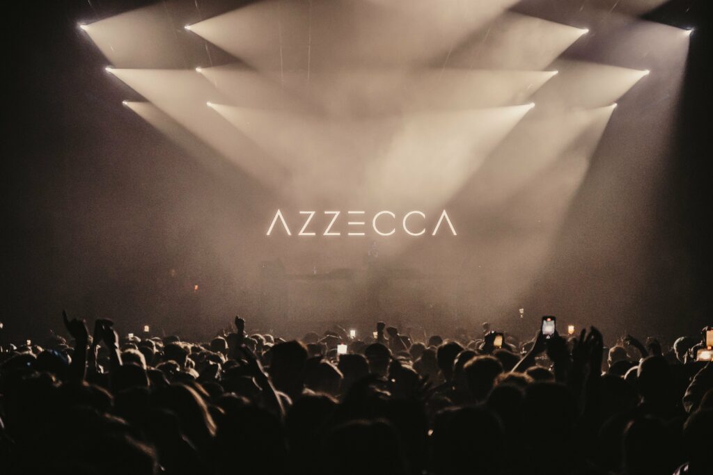 View facing the stage from the back at an Azzecca set with dark lights.