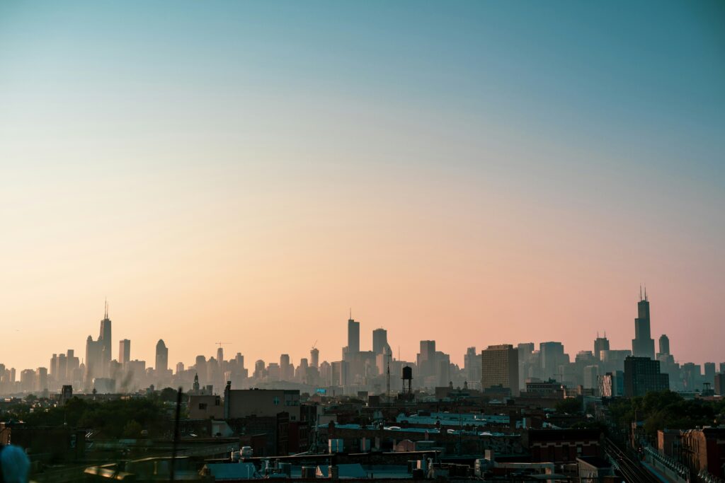 Sunrise view with blue and peach colors behind the Chicago skyline