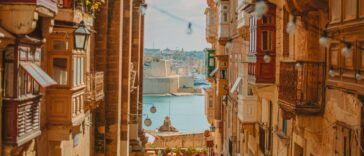 Photo looking down an alley towards the city in Valletta.