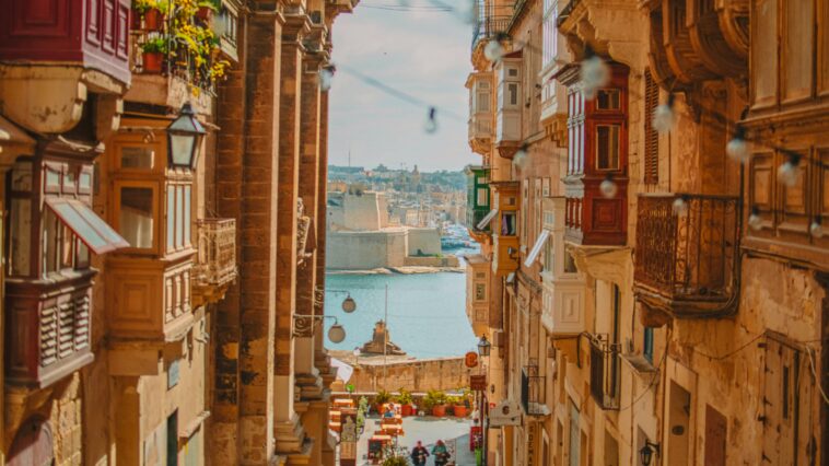 Photo looking down an alley towards the city in Valletta.