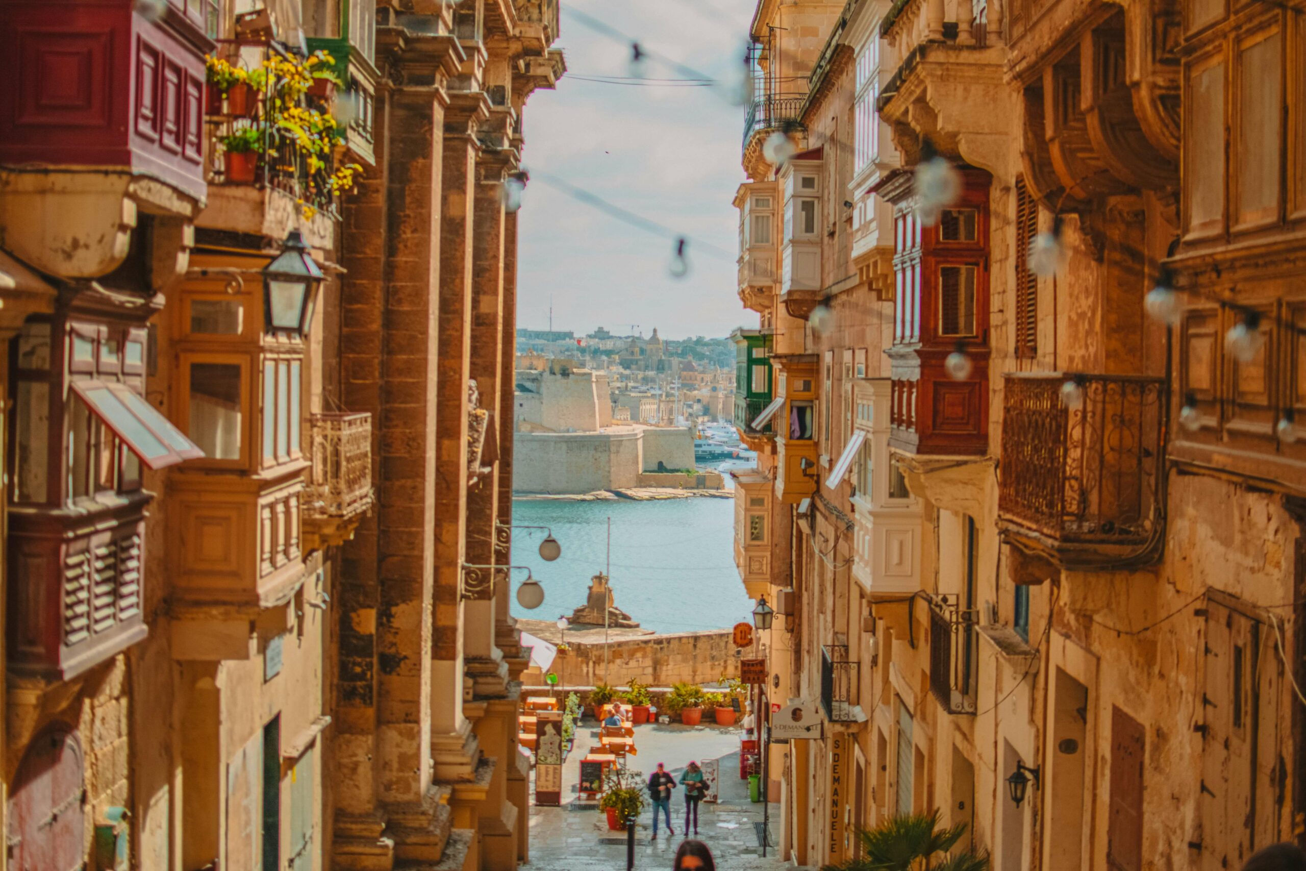 Photo looking down an alley towards the city in Valletta.