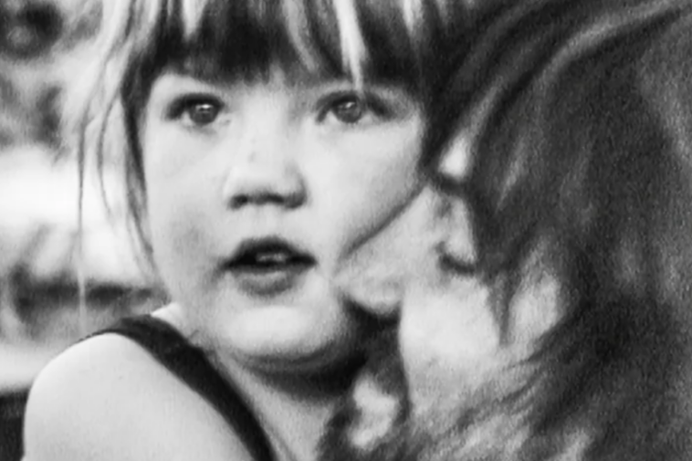 Father hugging girl in black and white