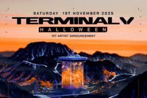 Terminal V Halloween poster with futurist tower in front of an orange sky.