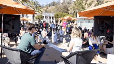 Conversation outside at the Music Tectonics Conference.