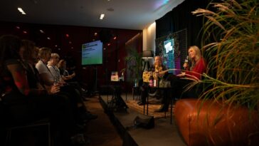 Panel discussion with two women on stage at Reeperbahn Festival & Conference